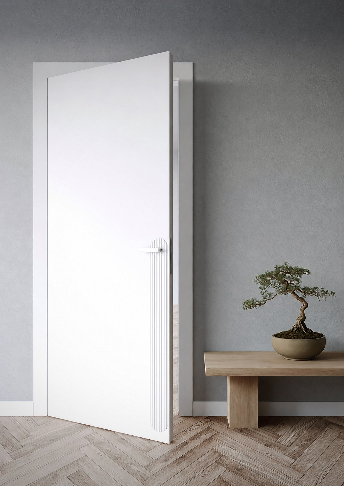 Una porta aperta su un pavimento in legno a spina di pesce